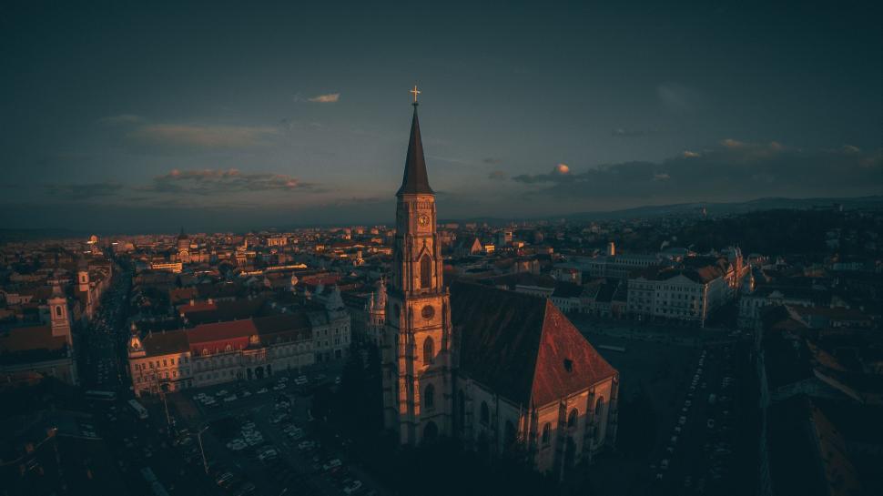 Free Image of Majestic church towers over the city at dusk or dawn 