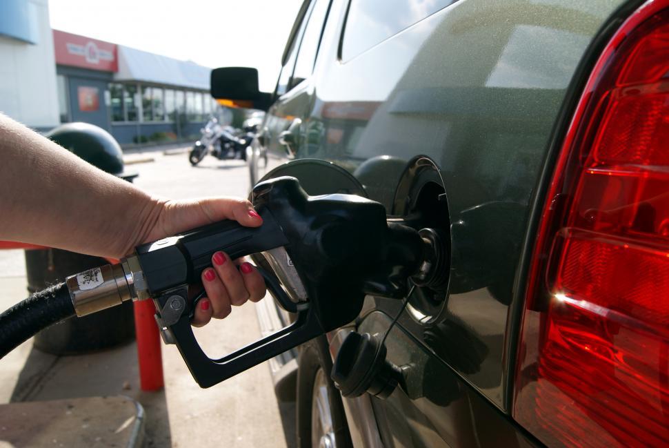 Free Image of Person Pumping Gas Into Car at Gas Station 