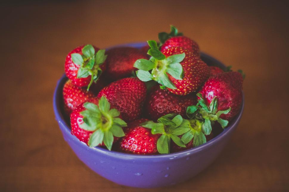 Free Image of A bowl filled with fresh red strawberries 