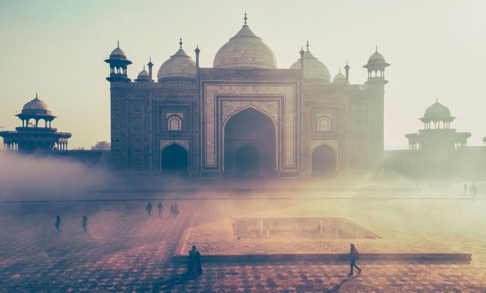 Free Image of Majestic ancient temple in morning fog, serene ambiance. 