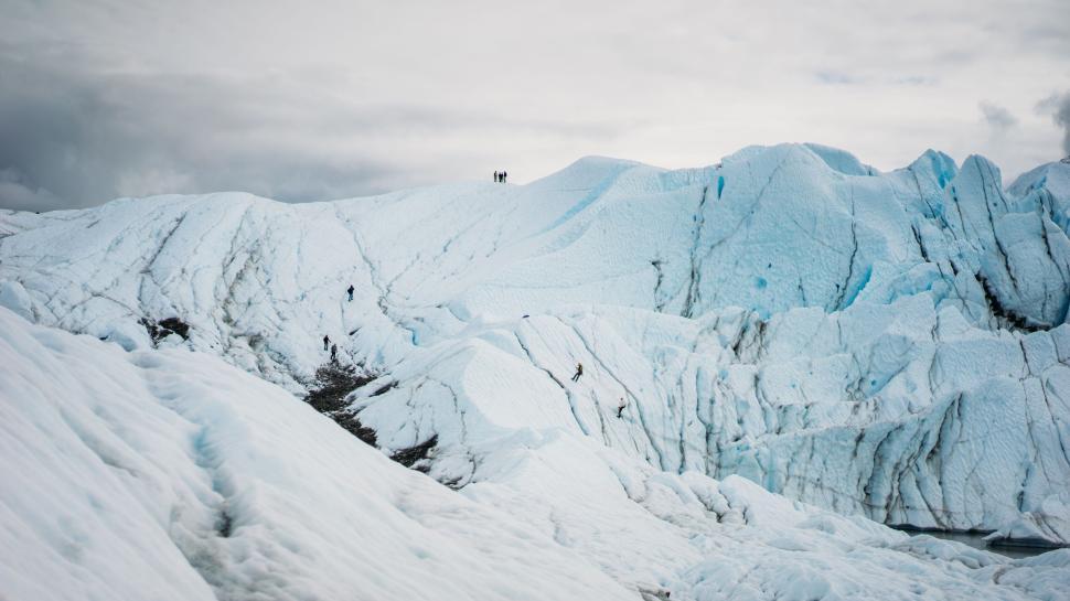 Free Image of Expansive ice landscape with climbers on Alaska glacier 