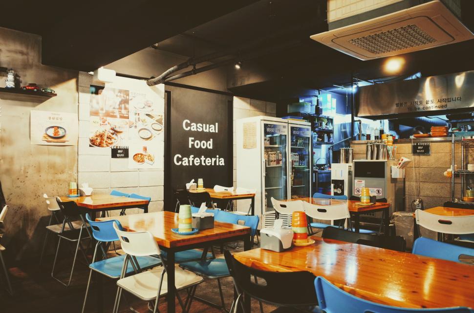Free Image of Casual Food Cafeteria with wooden table and chairs 