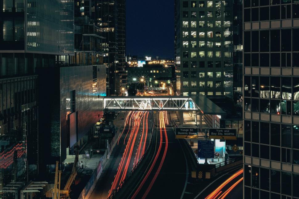 Free Image of City view with light trails and elevated walkway 