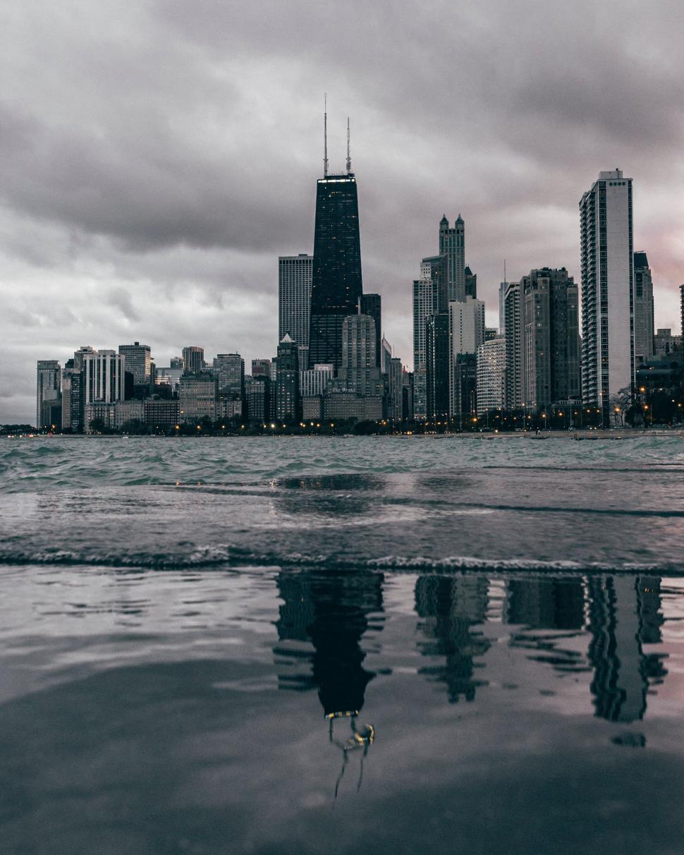 Free Image of Reflection of Chicago skyline with Hancock Center over water 