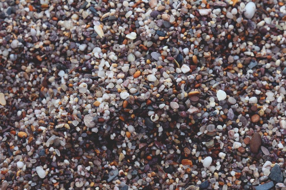 Free Image of Close-up of multicolored pebbles and stones on shore 