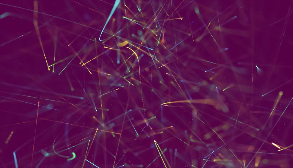 Free Image of Chaos of colorful light trails on a purple background 