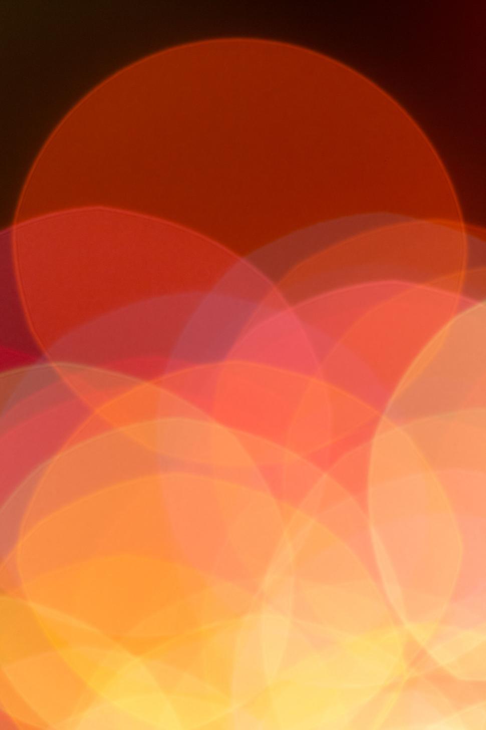 Free Image of Warm bokeh circles abstract vibrant background in red 