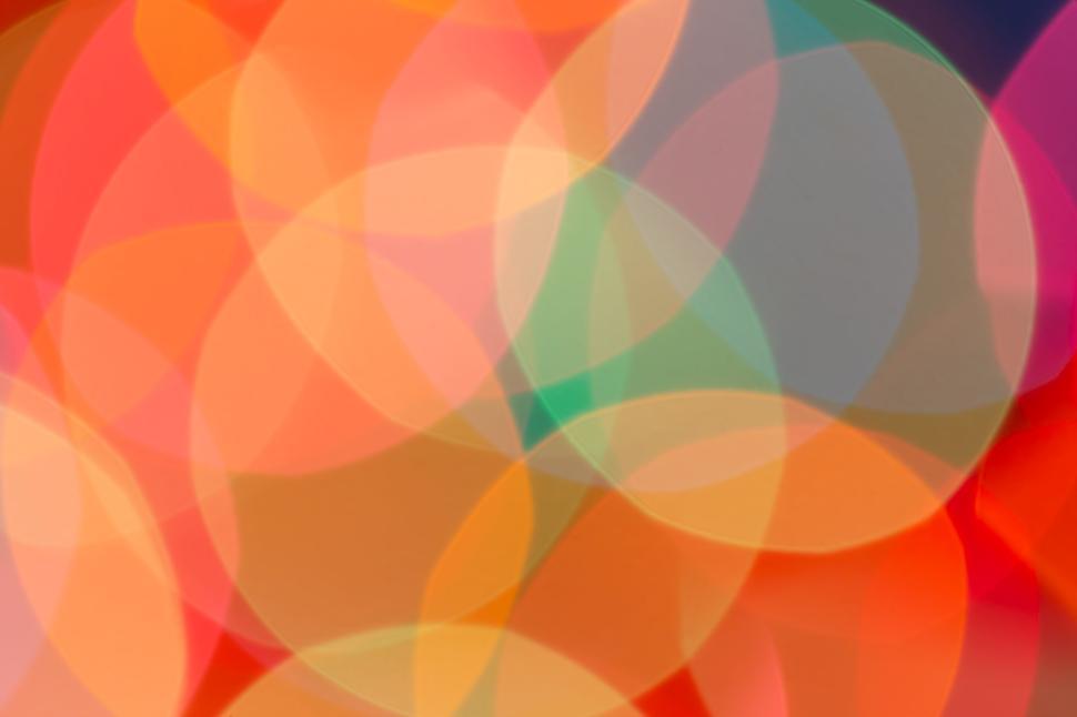 Free Image of Warm bokeh circles overlapping in vibrant color spectrum 