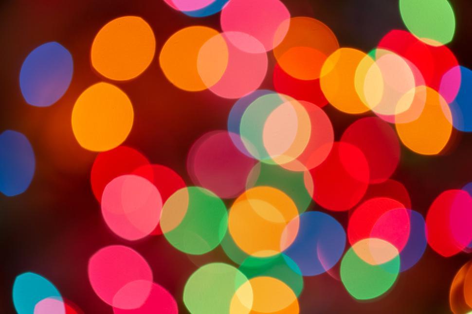 Free Image of Colorful bokeh lights with vibrant round shapes. 