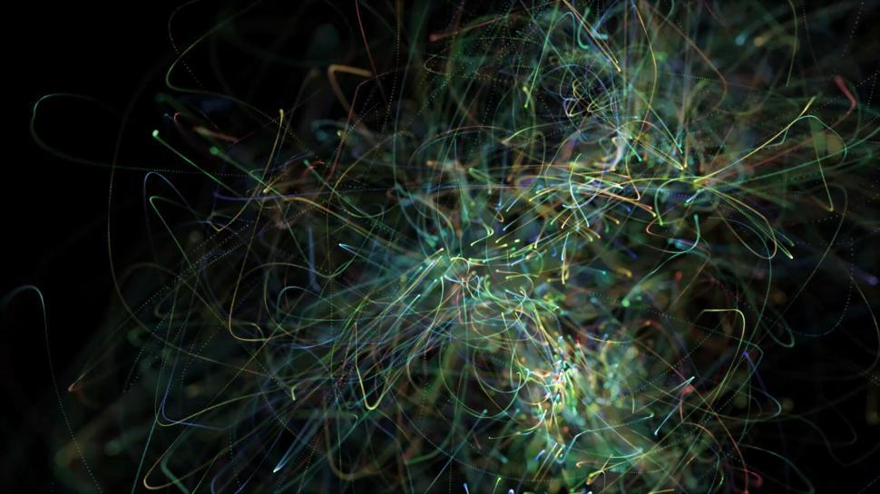 Free Image of Abstract colorful light streaks on a black background. 