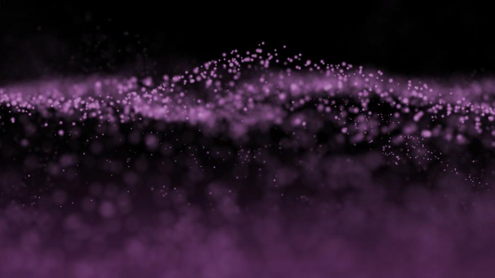 Free Image of Purple particles in wave-like formation on a black background. 