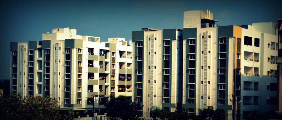 Free Image of Modern apartment buildings with symmetrical white facade 
