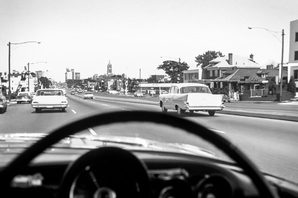 Free Image of Driving through city street with vintage cars, old times. 