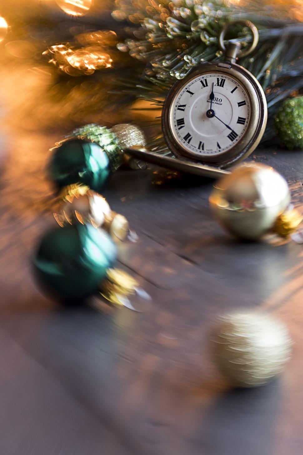 Free Image of Antique pocket watch with Christmas ornaments nearby. 