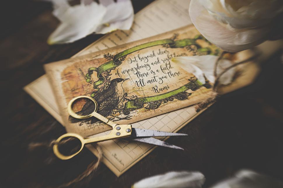 Free Image of Vintage card with flowers text and scissors around 