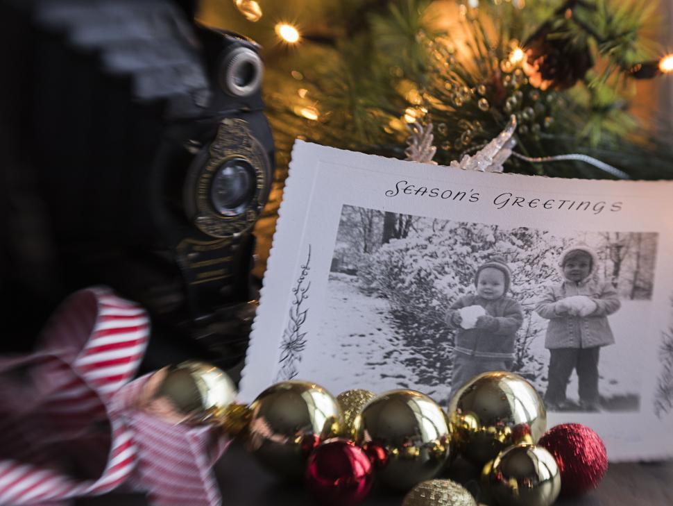 Free Image of Holiday season s greetings card with ornaments and photo. 