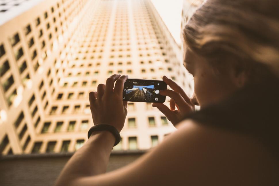 Free Image of Person capturing cityscape with mobile phone camera 