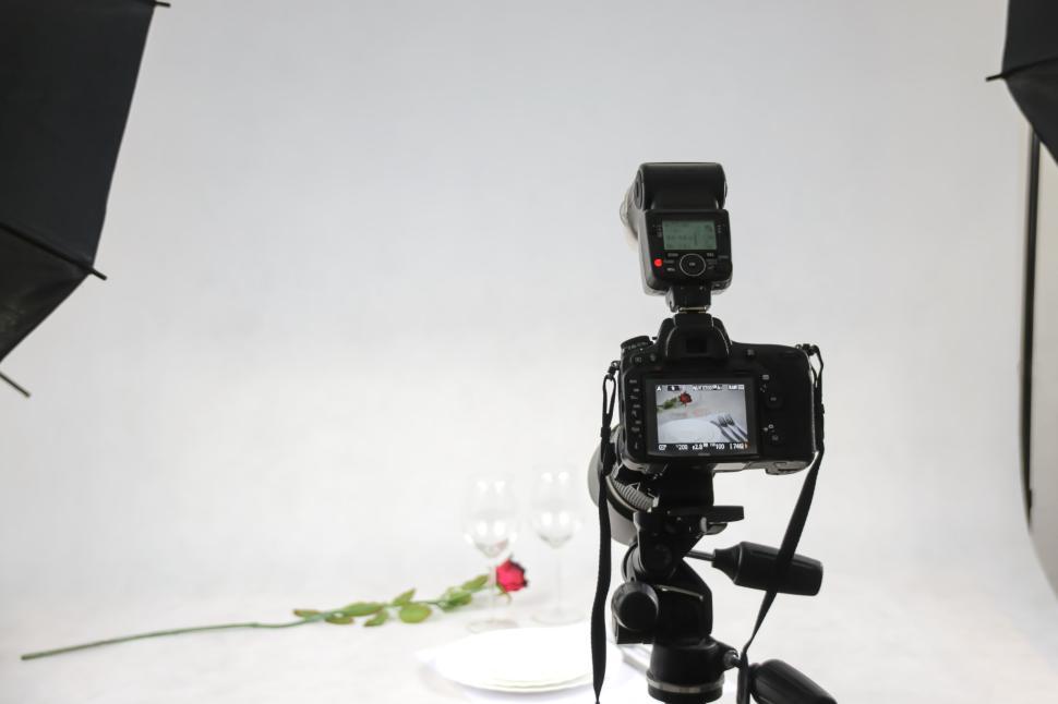 Free Image of Professional camera setup in studio with rose prop. 