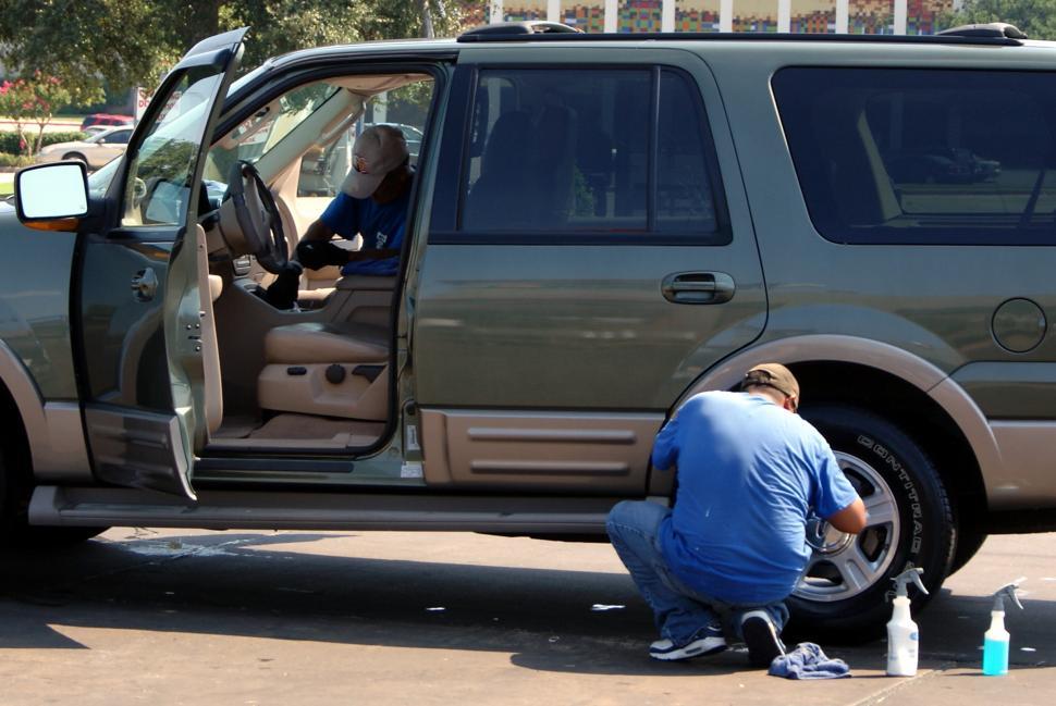Free Image of Cleaning the Wheels 