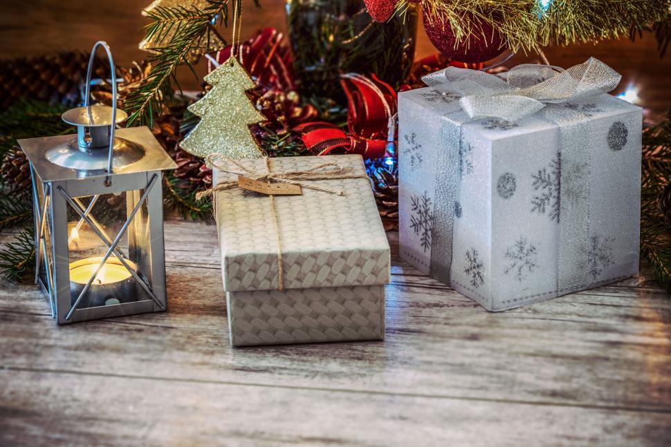 Free Image of Decorative gift boxes and candle with Christmas theme 