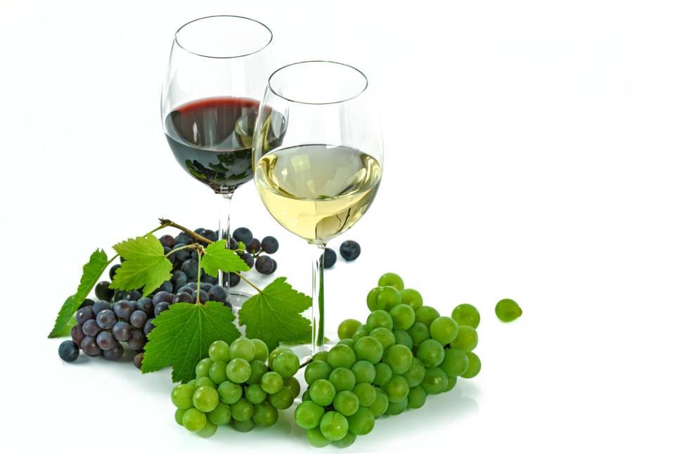 Free Image of Two wine glasses with grapes on white background 