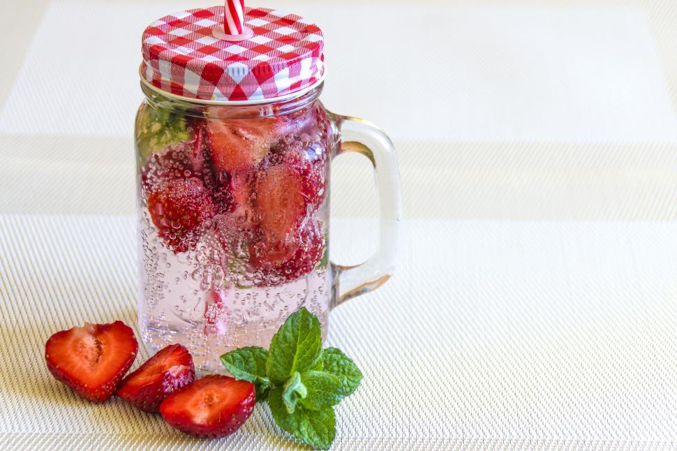 Free Image of Refreshing drink with strawberries and mint leaves. 
