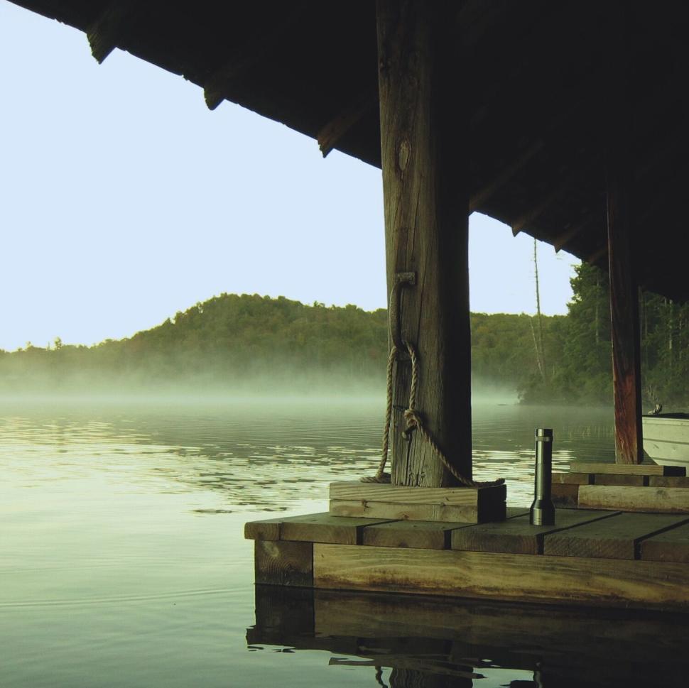 Free Image of Dockside evening view of a peaceful lake landscape 