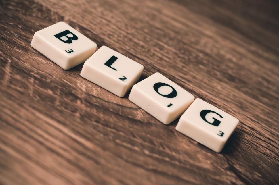 Free Image of Scrabble tiles spelling  BLOG  on a wooden surface. 