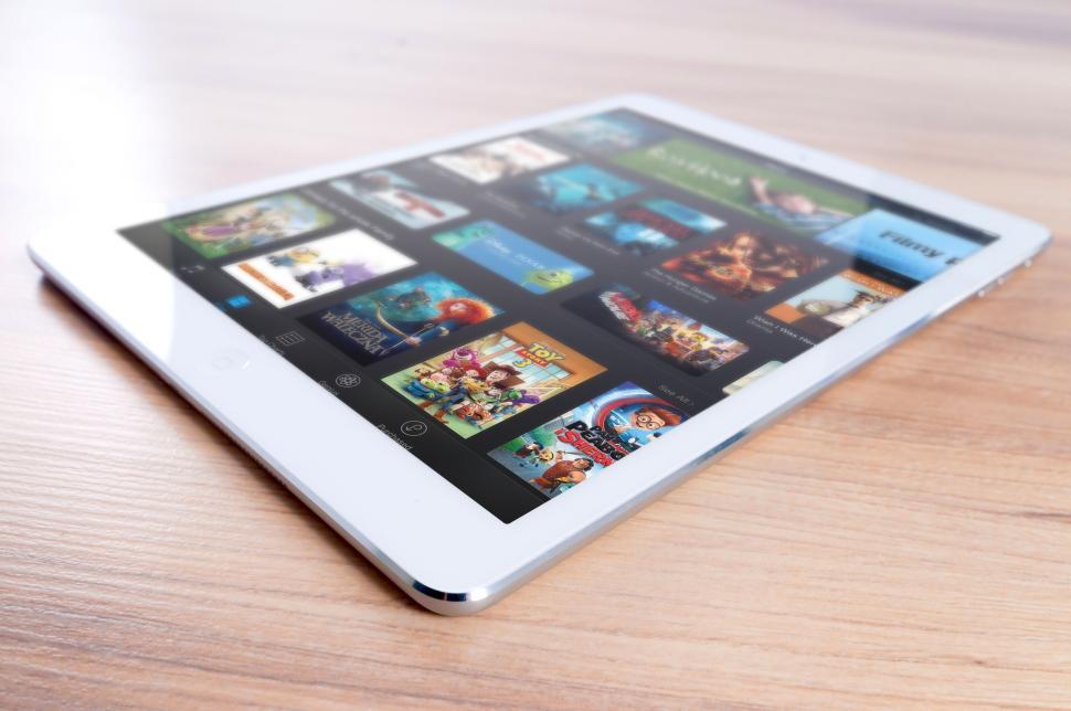 Free Image of Tablet with cartoon thumbnails displayed on the screen. 