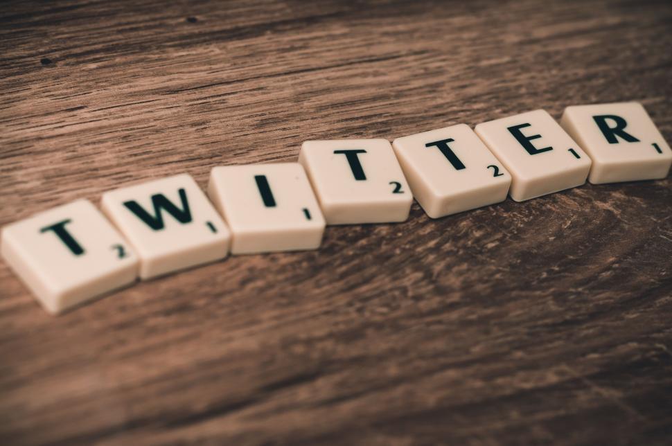 Free Image of Scrabble letters forming the word Twitter on wooden background. 