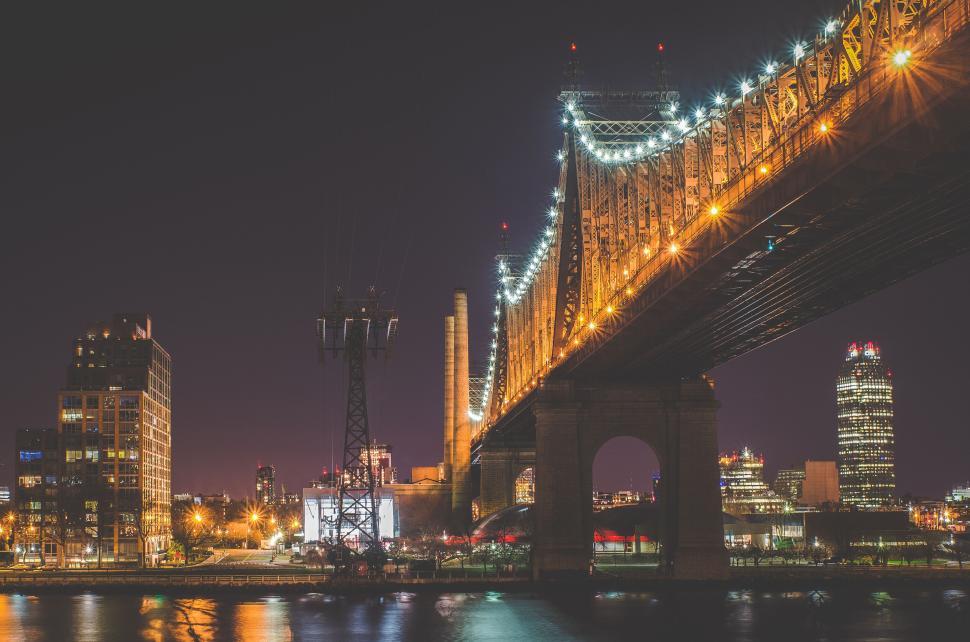 Free Image of Beautiful night view of illuminated bridge over river 