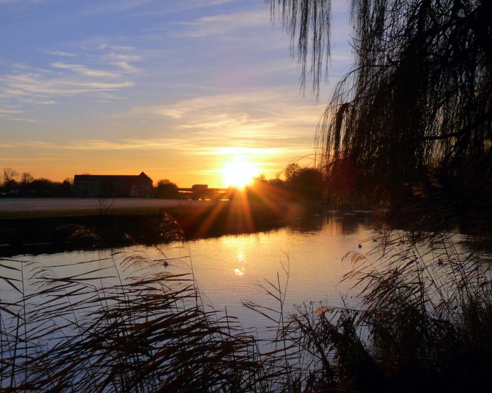 Free Image of Sun Setting Over River  