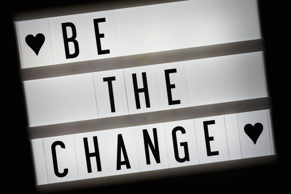 Free Image of Black and white  Be the Change  lightbox with hearts. 