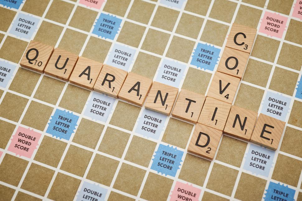 Free Image of Scrabble tiles forming  Quarantine  and  Covid  on board game. 