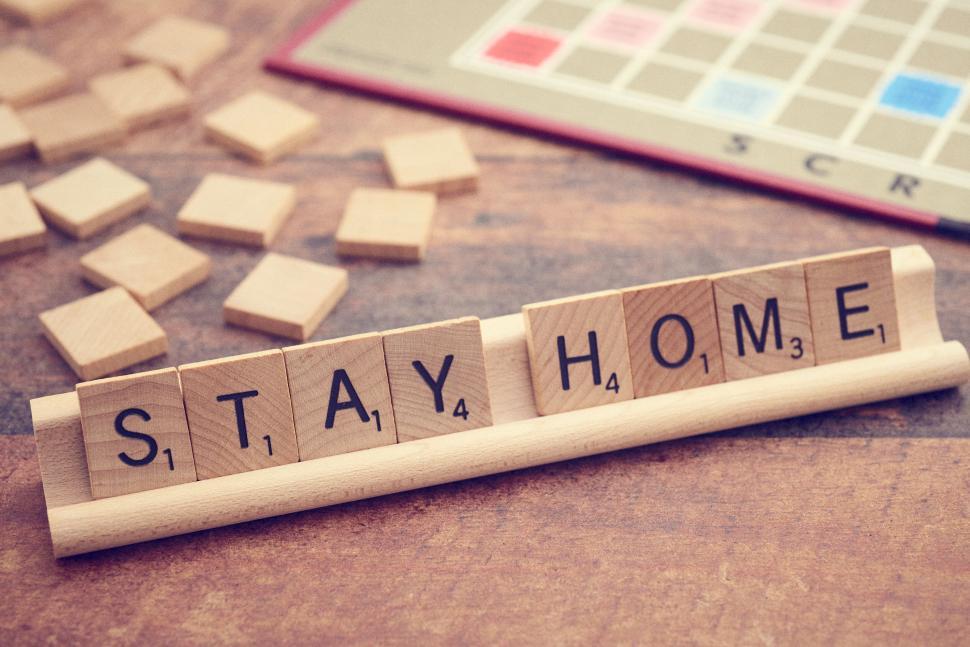 Free Image of Scrabble tiles spell  STAY HOME  conveying safety message 