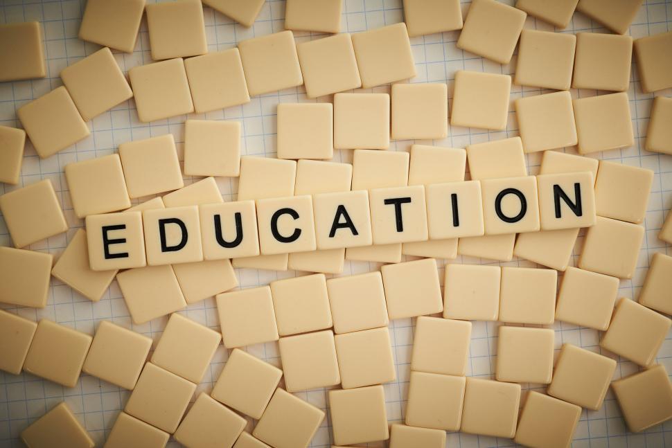 Free Image of Scrabble tiles spell  EDUCATION  under conceptually themed 
