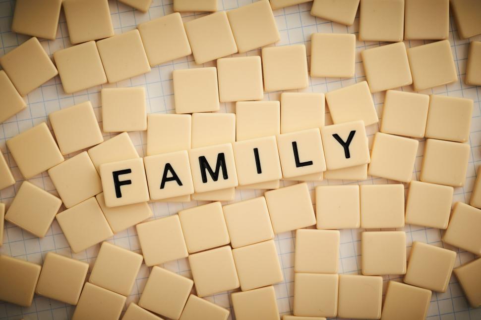 Free Image of Scrabble tiles spell  FAMILY  amidst arranged tiles 