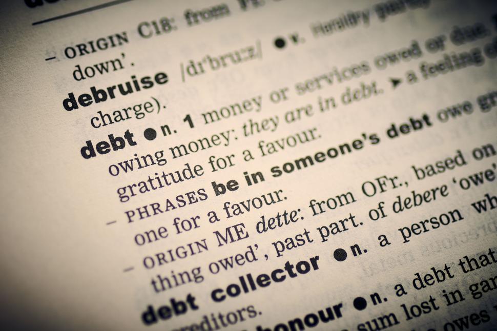 Free Image of Close-up of a dictionary page focusing on the word debt 