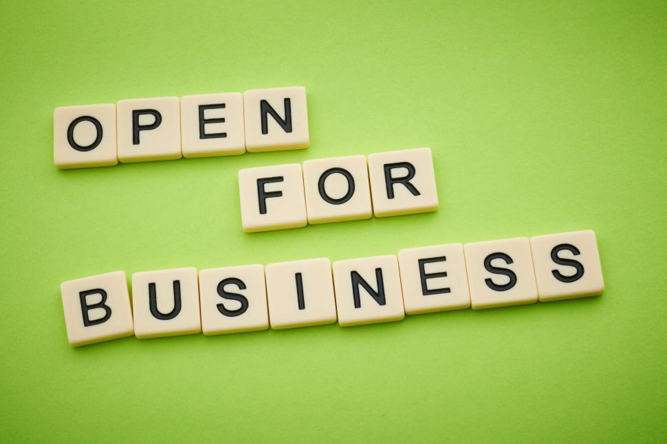 Free Image of Scrabble tiles forming the phrase  open for business  message 