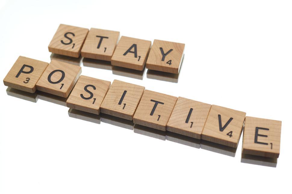 Free Image of Scrabble tiles arranged to spell  stay positive  phrase out 
