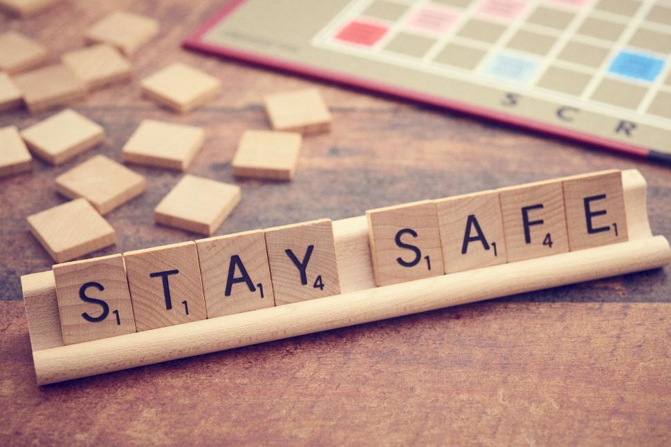 Free Image of Scrabble letters positioned to spell out  STAY SAFE . 