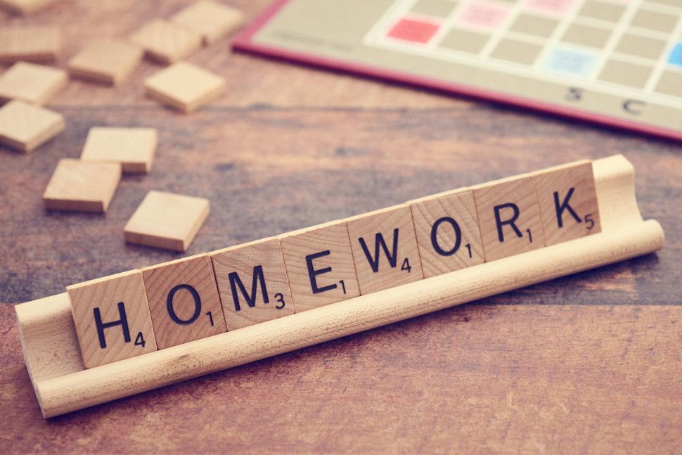 Free Image of Homework spelled out in wooden letter tiles on tray 