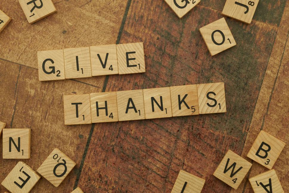 Free Image of Scrabble tiles spelling  give thanks  on wooden surface. 