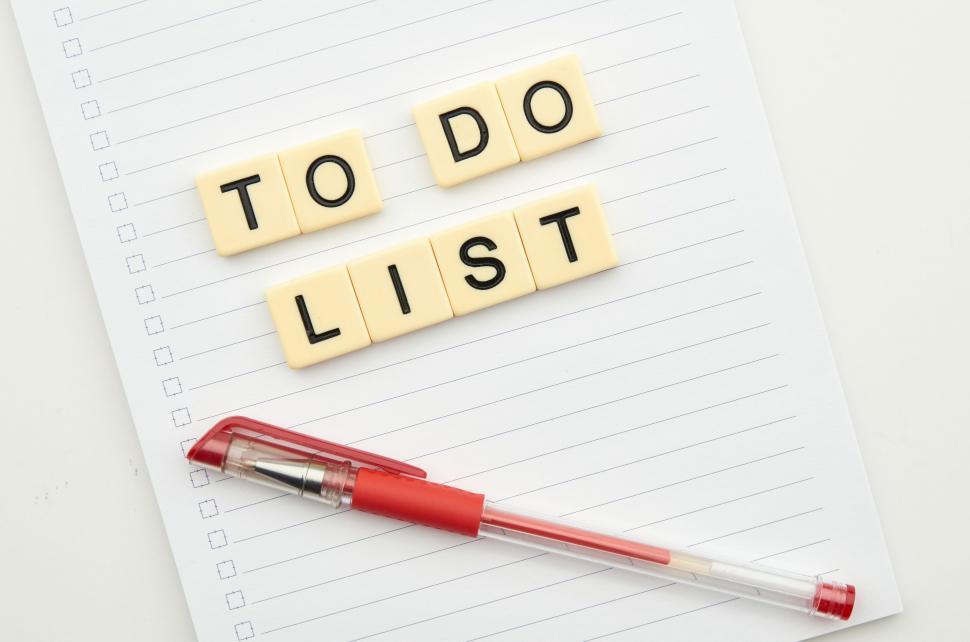 Free Image of Scrabble tiles spelling  to do list  next to a pen. 