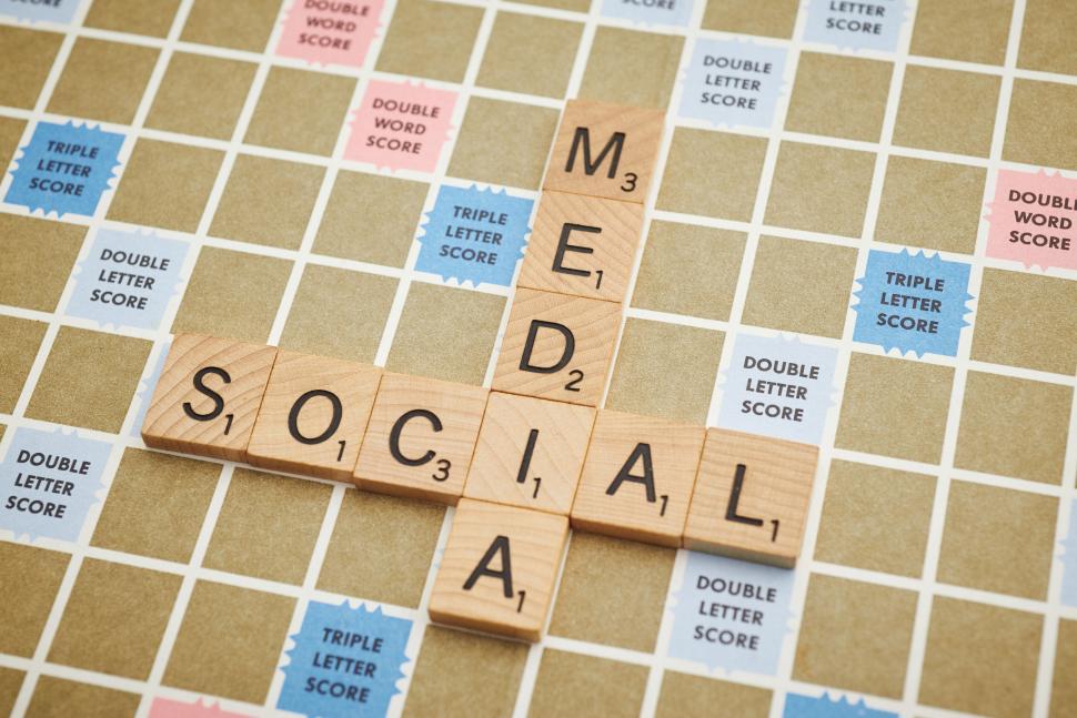 Free Image of Scrabble tiles spelling words Social Media on board game. 