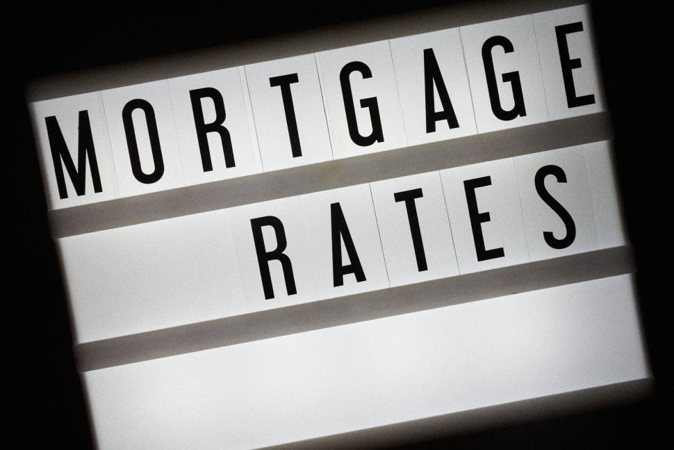 Free Image of Sign displaying the words Mortgage Rates in bold letters. 