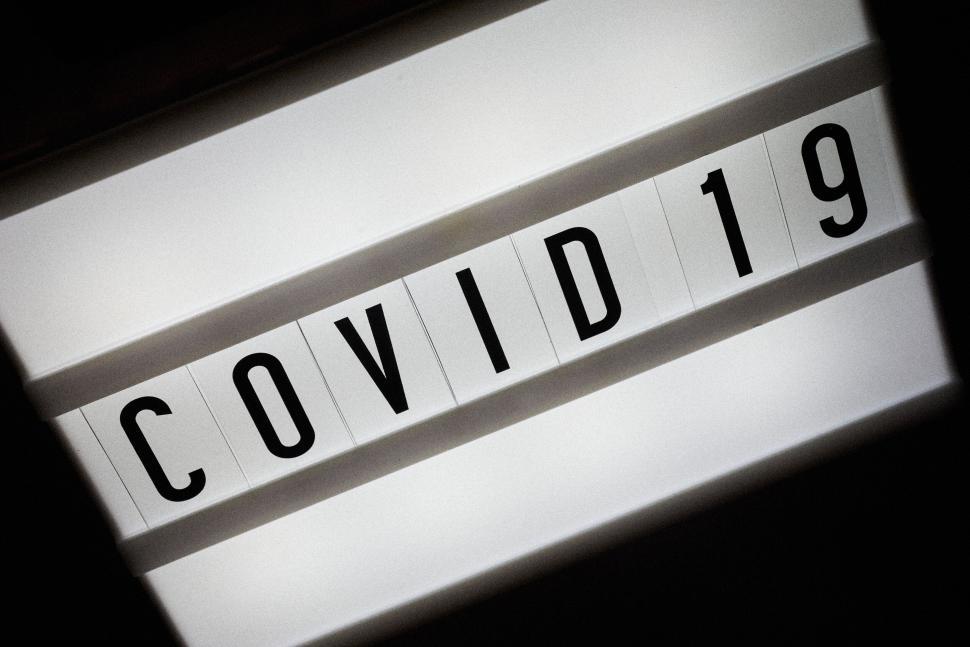 Free Image of Lightboard displaying the text COVID 19 in bold letters 