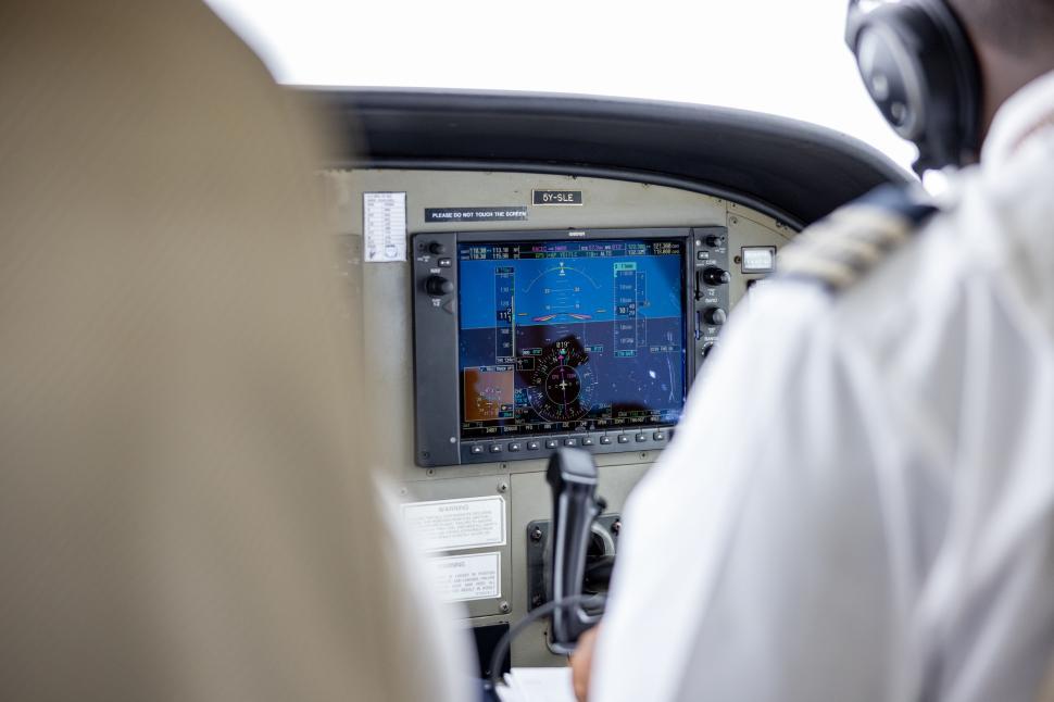 Free Image of Cockpit view inside a small aircraft during flight 