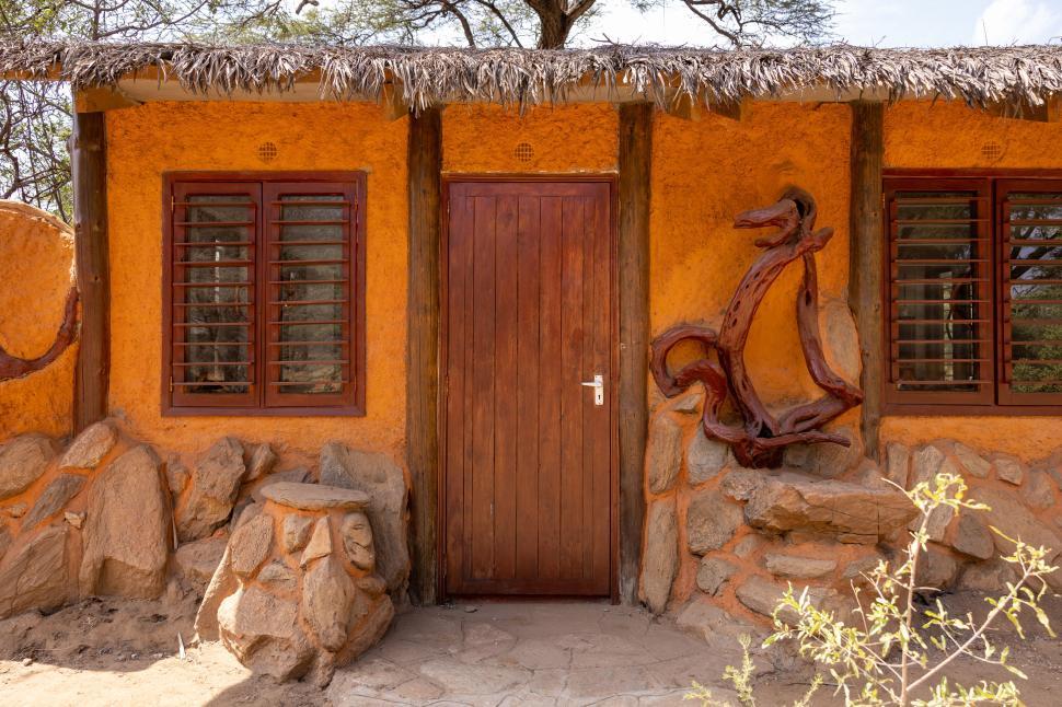 Free Image of Rustic building with wooden door in earthy colors. 