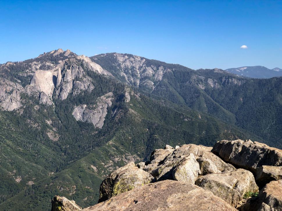 Free Image of Majestic mountain range with clear blue sky in background 